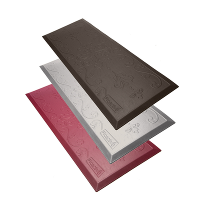 The Proactive Protekt® Beveled Fall Cushioned Floor Mat features three decorative rectangular panels in brown, silver, and red with swirling embossed patterns and Peachy logos, stacked for a stylish, low-profile look against a white background.