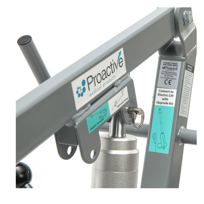 Close-up of a gray metal Proactive Protekt® Transformer Hydraulic or Powered Patient Lift frame with key lock, instruction labels, and left-side handle, ideal for safe and easy homecare patient transfers.