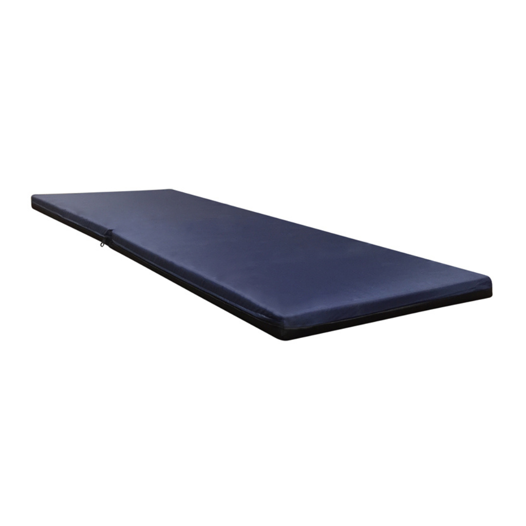 The Proactive Protekt® Safety Foam Fall Mat is a thin, rectangular, dark blue impact-resistant foam mat with a plain surface, ideal for gym use or bedside fall protection. It lies flat on any surface for effective safety.
