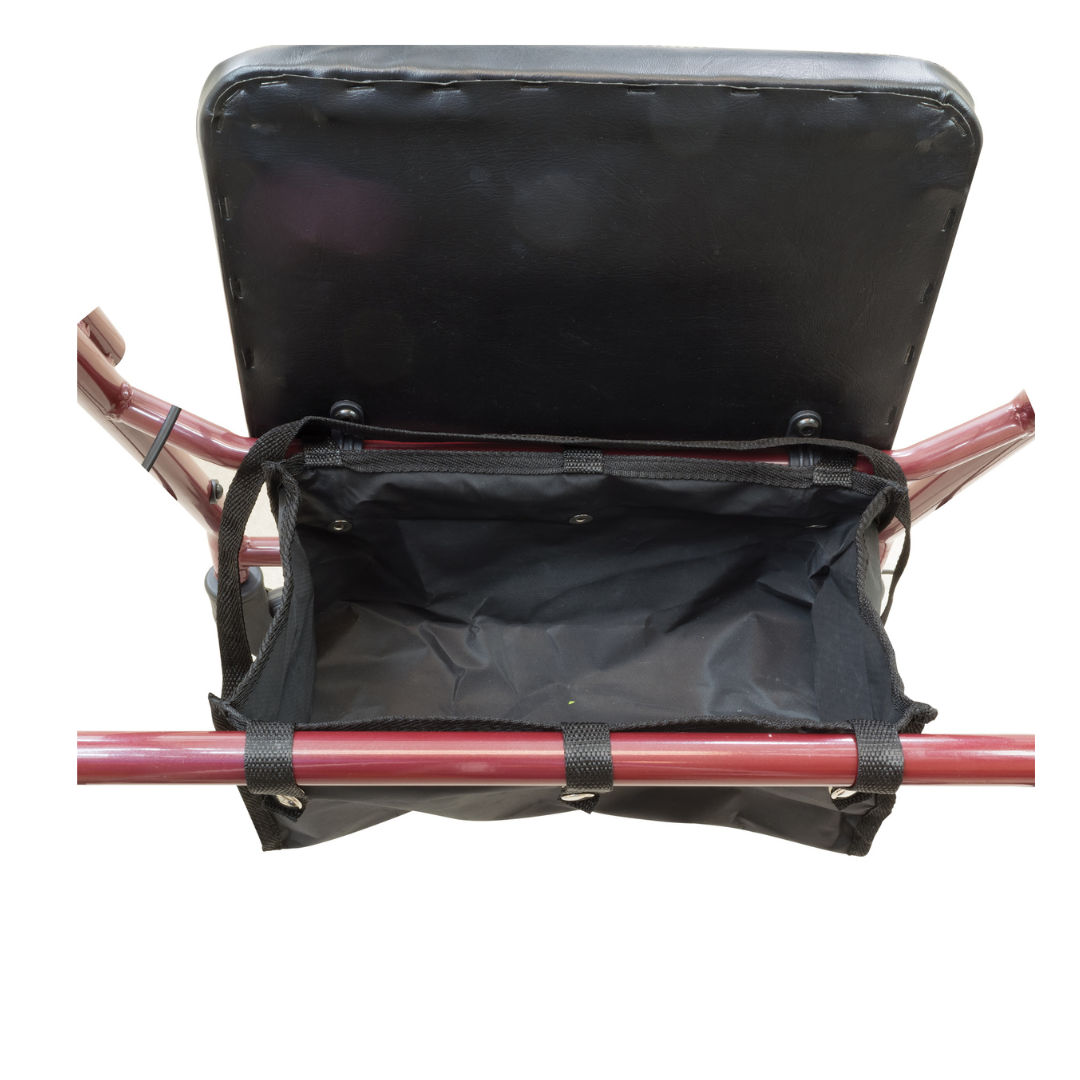 A close-up of the storage pouch beneath the padded seat of the ProBasics Lightweight Steel Portable KD Rollator shows an empty black fabric compartment securely fastened to the frame.