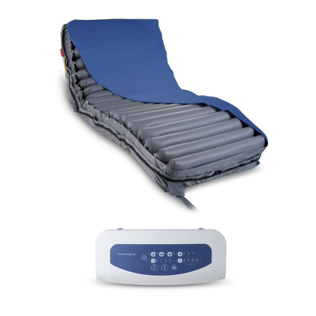 A Wellell Procare Auto G2 Alternating Pressure & LAL Mattress System with alternating pressure tubes and a blue cover is displayed, accompanied by a separate electronic control panel positioned below it. This mattress system ensures optimal comfort and support for users.