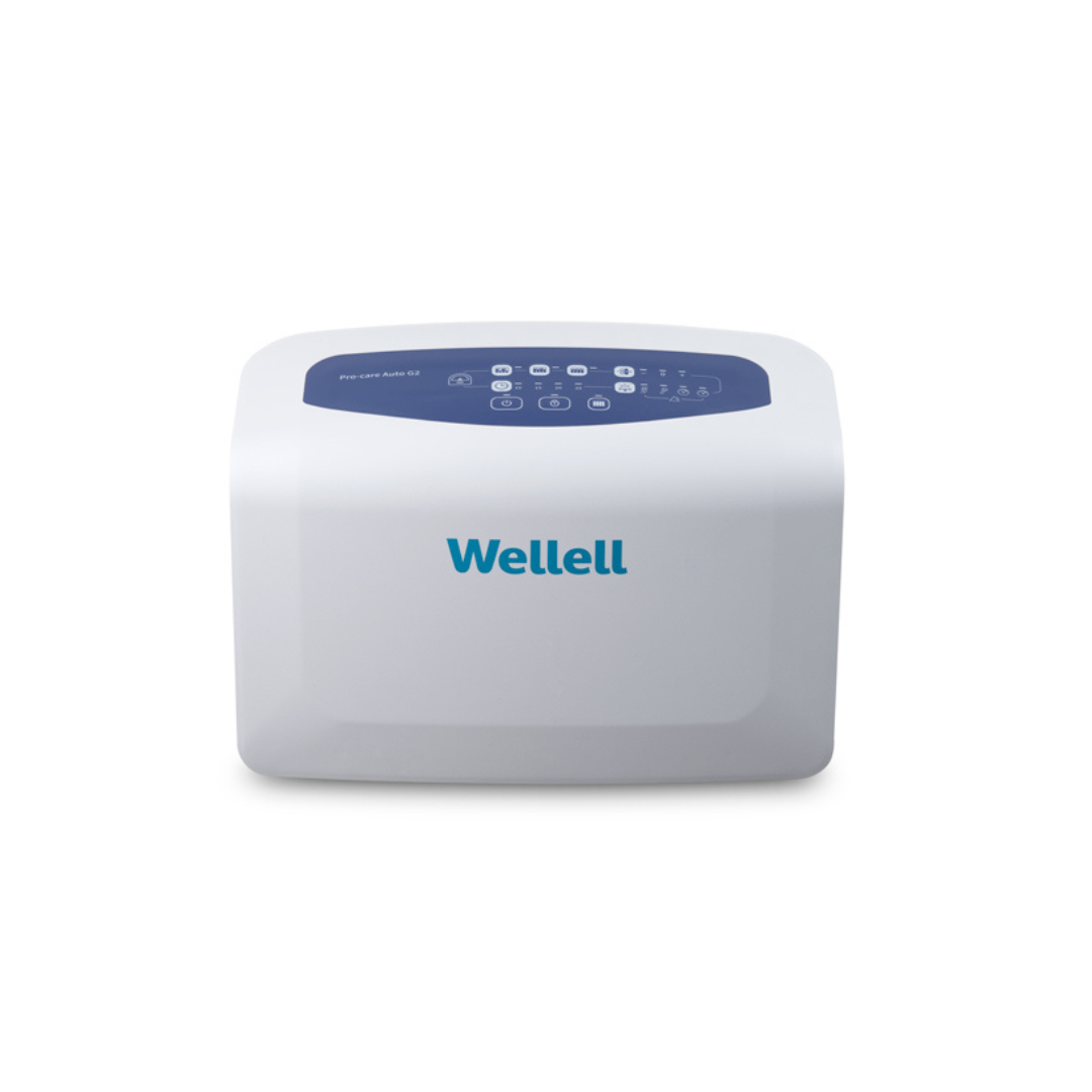 A sleek white medical device with a dark blue control panel on top—featuring multiple buttons and indicators—with the Wellell brand name displayed on the front. This unit is specifically designed for use with the Wellell Procare Auto G2 | Alternating Pressure & LAL Mattress System, ensuring advanced comfort and support as part of a state-of-the-art alternating pressure mattress solution.