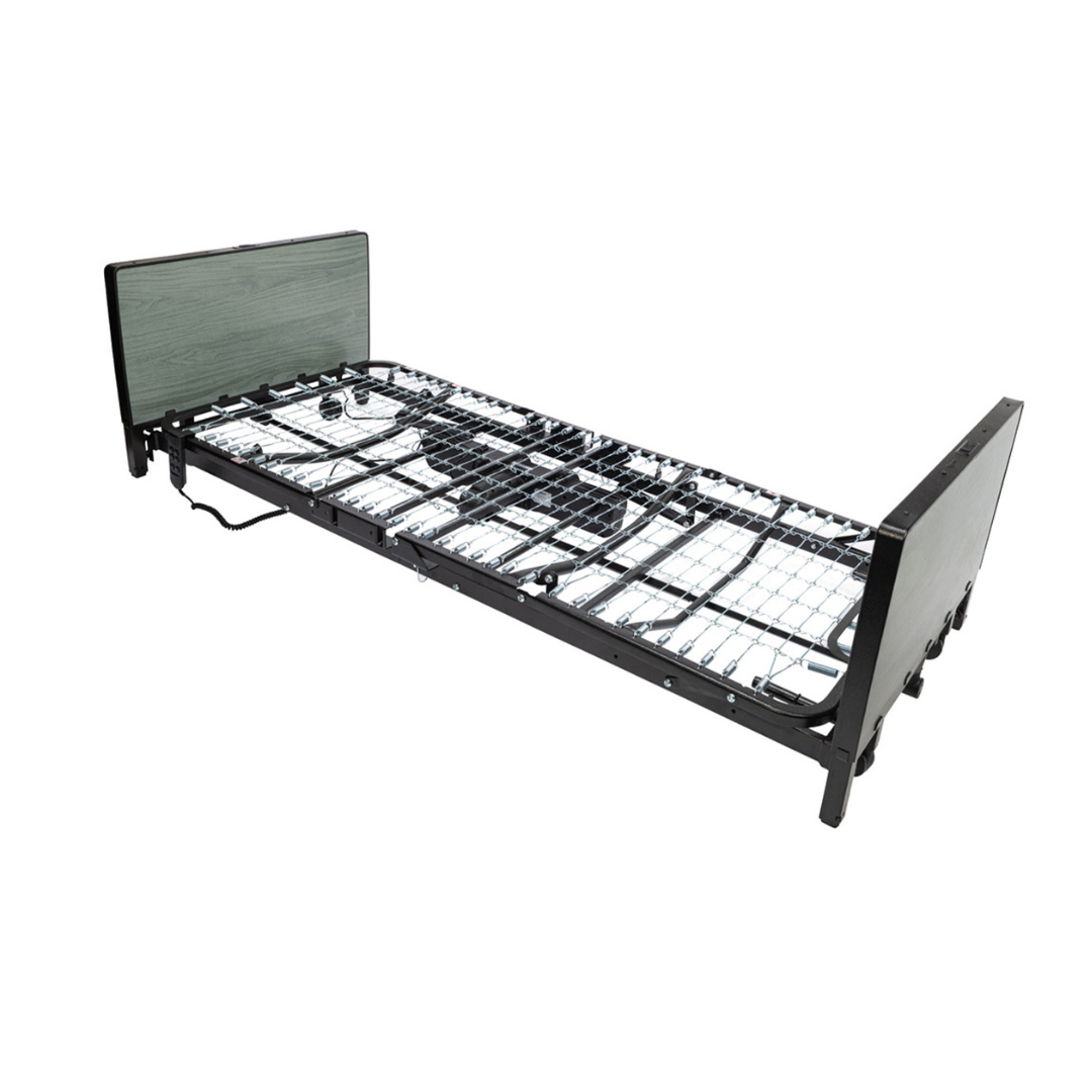A metal adjustable homecare bed frame with a wired grid base, dark headboard, and footboard—displayed against a white background—this design is ideal for those seeking the reliability of a full-electric low bed like the Protekt Akra-FE™ Full-Electric Bariatric “Low” Bed.