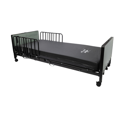 The Protekt Akra-FE™ Full-Electric Bariatric “Low” Bed features a sleek black design with side rails, a slim mattress, and caster wheels on each leg. Engineered for medical or assisted living environments, this bed offers an optimal homecare solution.