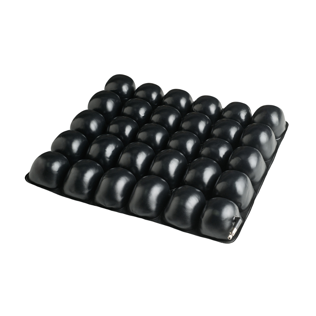 The Protekt® Revel Air Cushion is a premium black seat cushion with a grid of raised air cells for superior comfort and pressure relief, shown here against a white background.