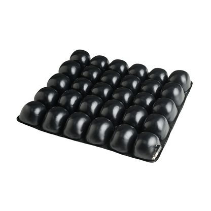 The Protekt® Revel Air Cushion is a premium black seat cushion with a grid of raised air cells for superior comfort and pressure relief, shown here against a white background.
