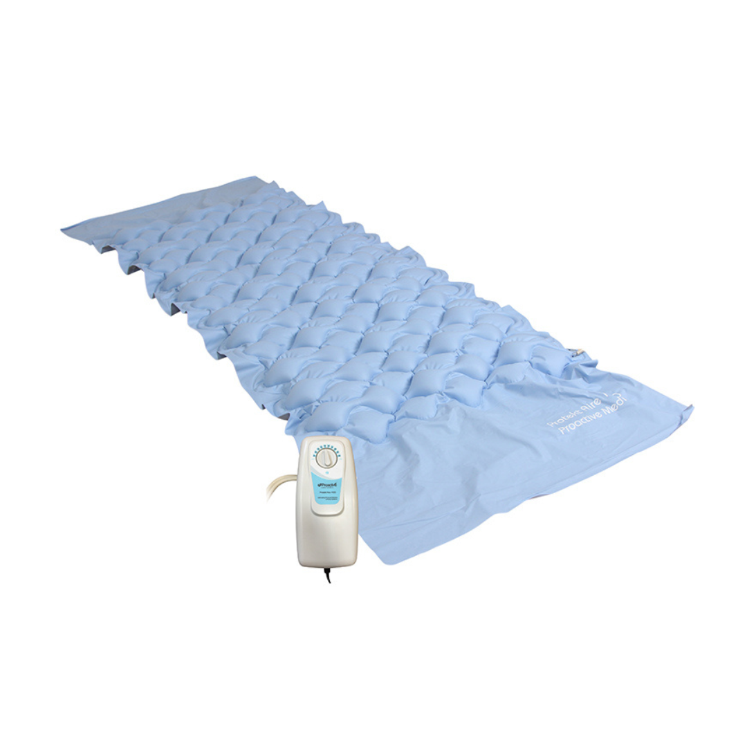 The Proactive Protekt® Aire 1500 Deluxe Adjustable Alternating Pressure Overlay, shown in light blue with a textured surface and paired with a white-and-blue electric pump, is ideal for pressure ulcer prevention.