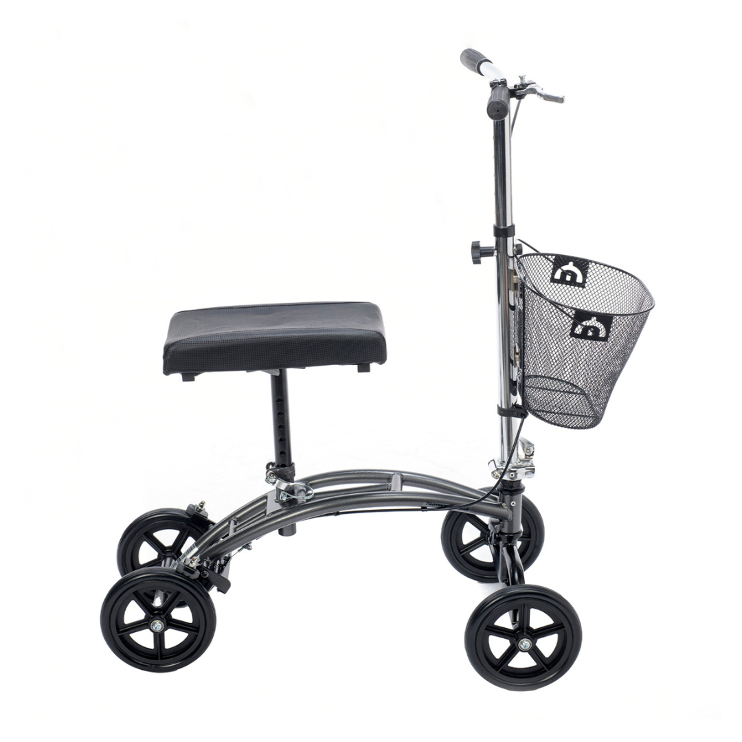 The Proactive Protekt® Gazelle Portable Knee Walker is a black four-wheeled mobility aid with a padded knee rest, handlebars, and a wire basket, designed for foot and ankle recovery as an alternative to crutches.