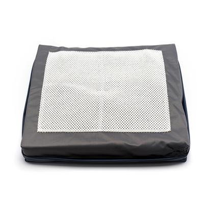 The Protekt® Seat Relief - Alternating Pressure Seat Cushion System by Proactive is a black rectangular portable cushion with a white perforated mat on top, designed for pressure injury prevention. Shown against a plain white background.