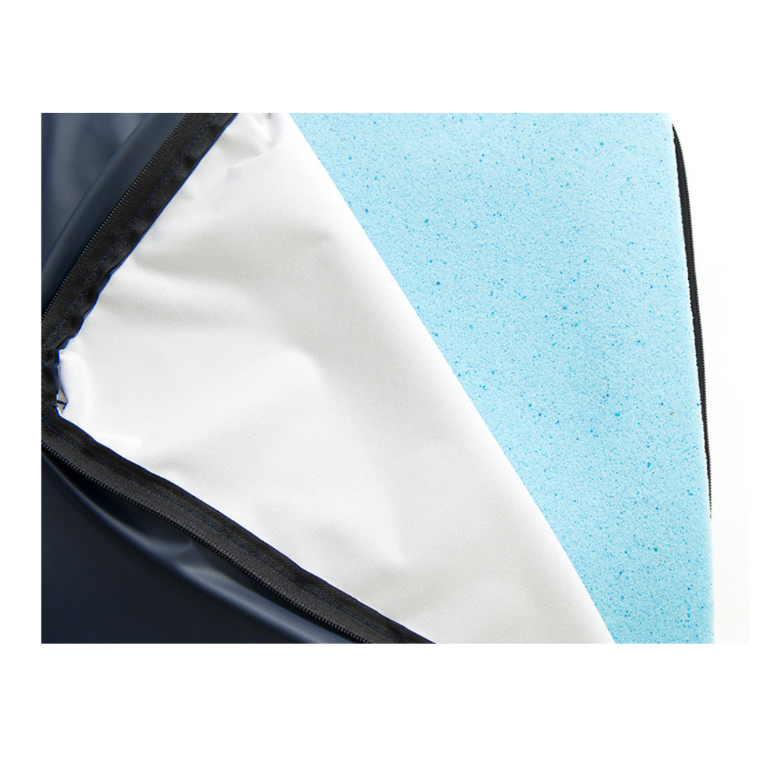 A close-up of the Protekt® Seat Relief - Alternating Pressure Seat Cushion System by Proactive shows its corner with the cover partially unzipped, exposing a layer of light blue foam inside.