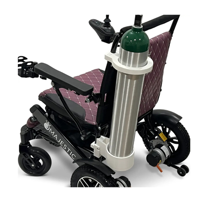 A Quick Detach Oxygen E Tank Holder for ComfyGo Powerchairs is securely mounted behind the maroon quilted seat, holding a large oxygen cylinder.