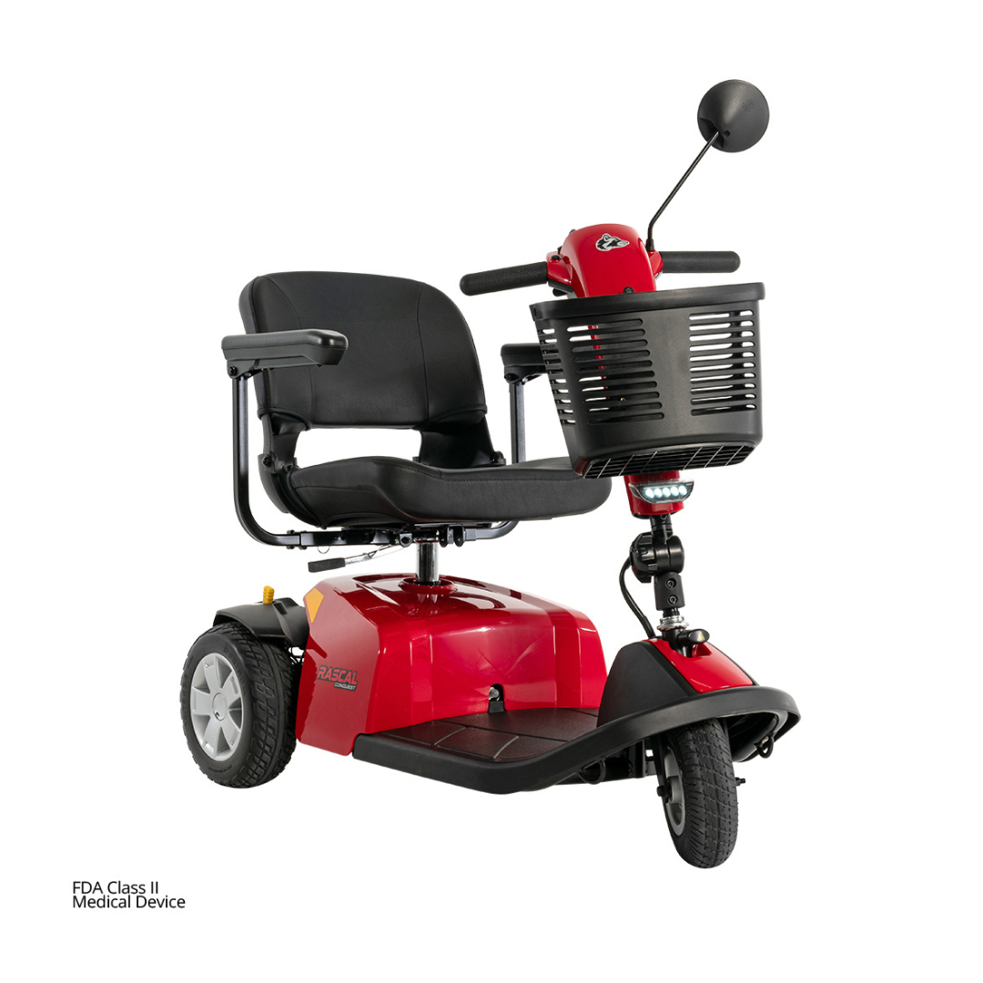 A red Rascal® Conquest 3-Wheel Mobility Scooter featuring a black seat, armrests, front basket, and rearview mirror, designed for personal transportation and mobility assistance.