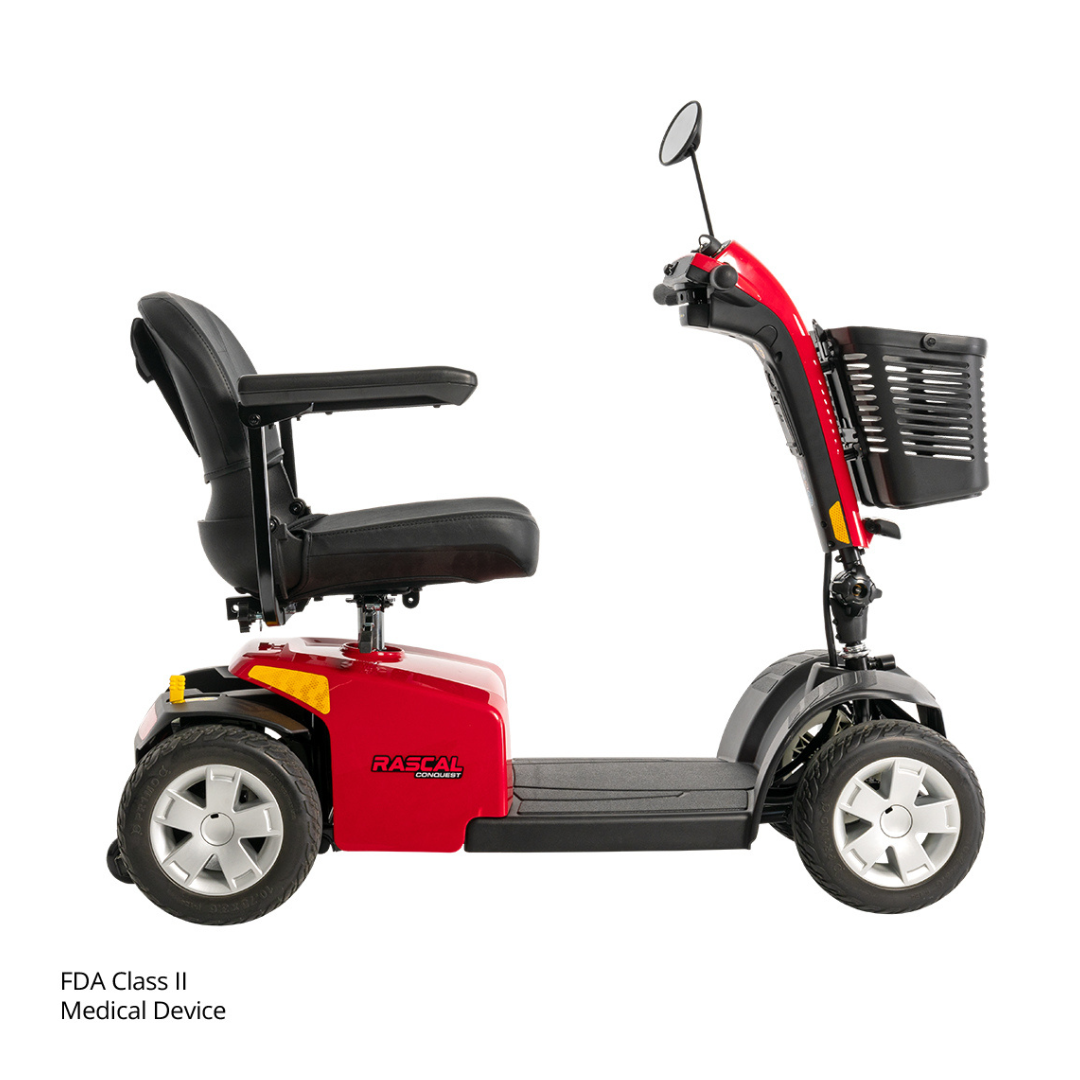 Rascal® Conquest 4-Wheel Mobility Scooter shown from the side with a black seat, armrests, front basket, and four wheels. This mid-size scooter is labeled Rascal. Text in the corner reads FDA Class II Medical Device.