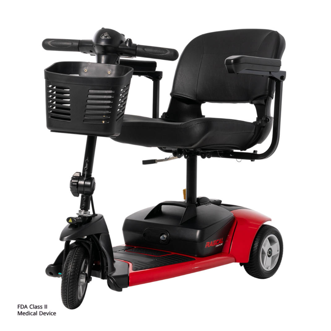 The Rascal Venture 3-Wheel Portable Scooter, in red and black, features a black seat, armrests, front basket, sturdy base with small wheels, and is classified as an FDA Class II Medical Device.