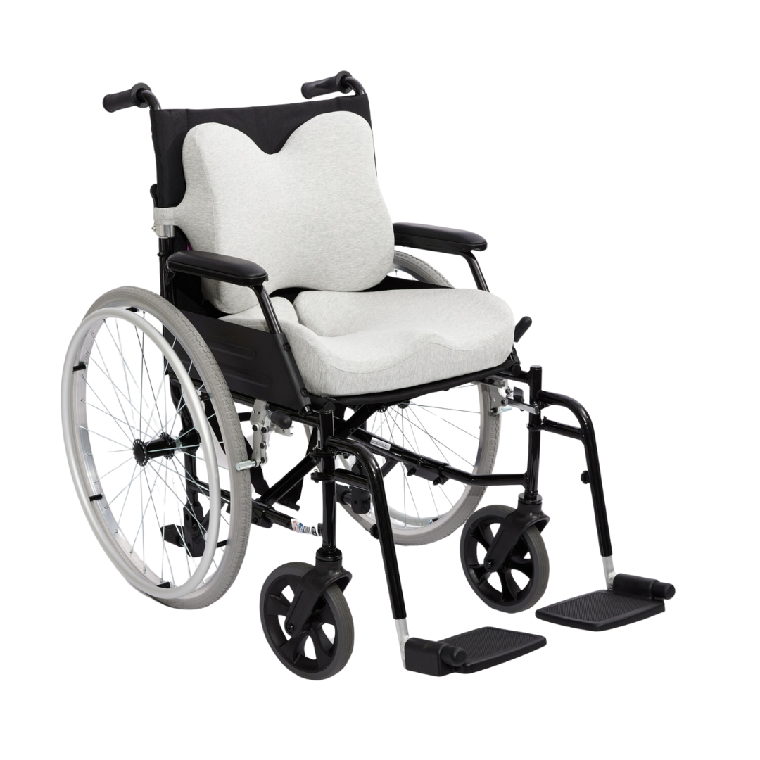 The iCare Reform Low Back Support offers targeted lumbar relief with its ergonomic, contoured light gray cushions for seat and back, ideal for black manual wheelchairs featuring large rear wheels, small front wheels, and adjustable footrests.