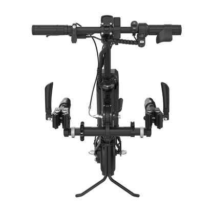 Top-down view of the Rehasense ECO Travel BX Power Add-On – Lightweight Wheelchair Assist mounted on a manual wheelchair, spotlighting its drop handlebars, gear shifters, brake levers, and central stand near the front wheel.