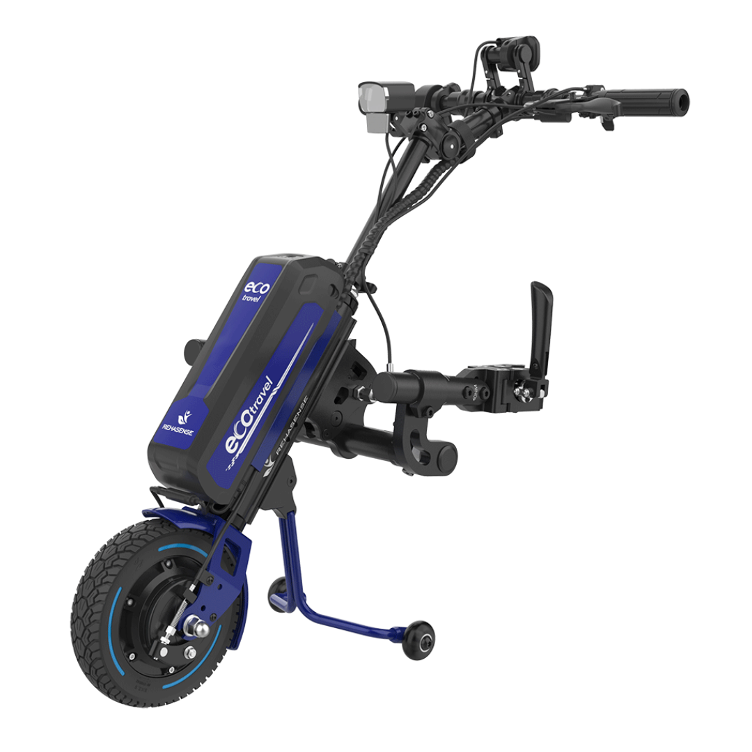 The Rehasense ECO Travel LX Power Add-On is a lightweight, single-wheeled motor assist with a blue frame, battery pack, black handlebars, and small support wheels, designed to boost the mobility of manual wheelchairs.