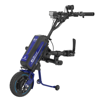 The Rehasense ECO Travel LX Power Add-On is a lightweight, single-wheeled motor assist with a blue frame, battery pack, black handlebars, and small support wheels, designed to boost the mobility of manual wheelchairs.