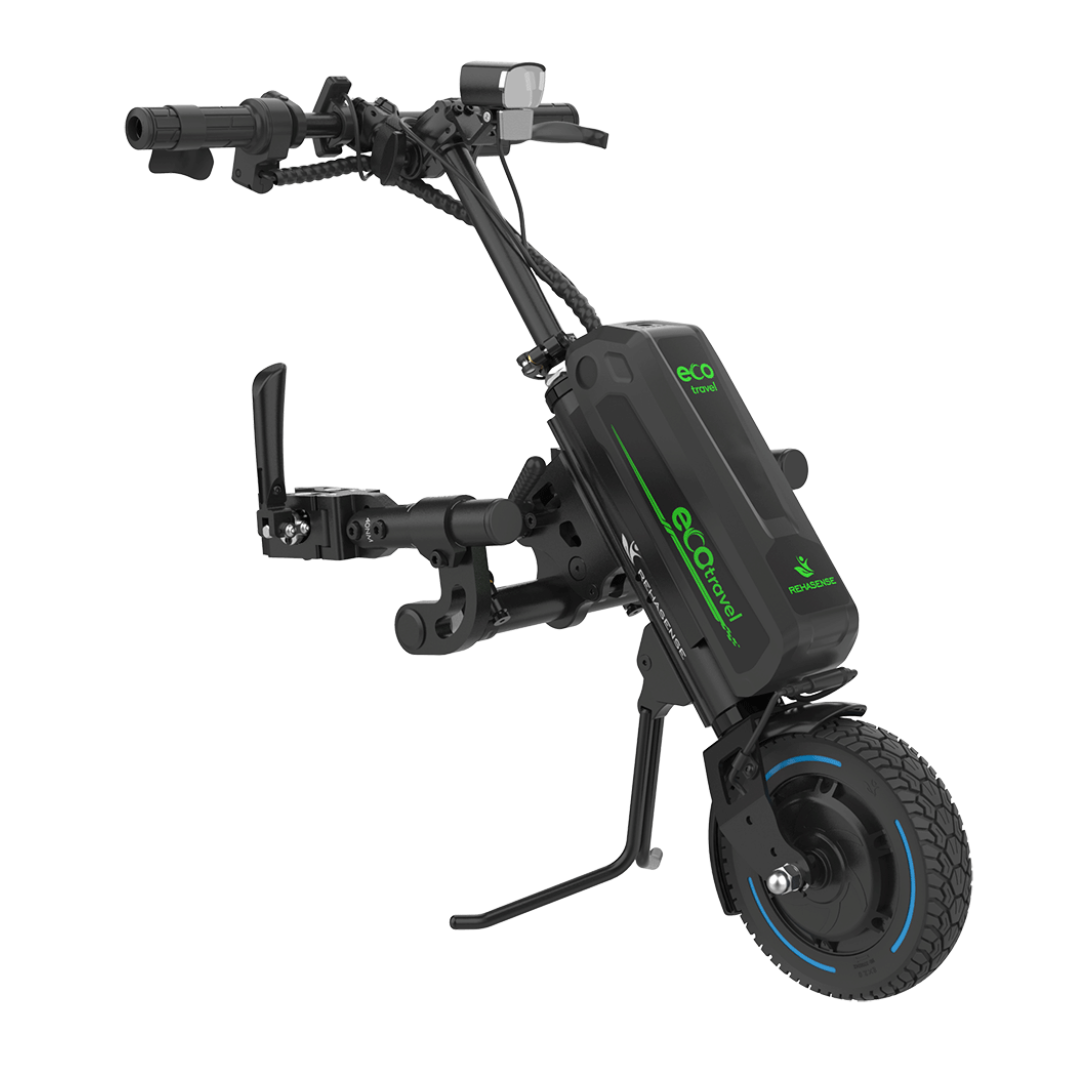 The Rehasense ECO Travel LX Power Add-On is a compact black device with a single front wheel, handlebars, digital display, and green eCompact branding, designed to convert manual wheelchairs to electric-powered.