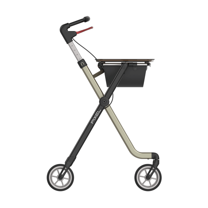 The Rehasense Pixel Indoor Rolling Walker features a black and beige minimalist frame, two large wheels, a flat tray surface, and a small storage compartment below the tray.