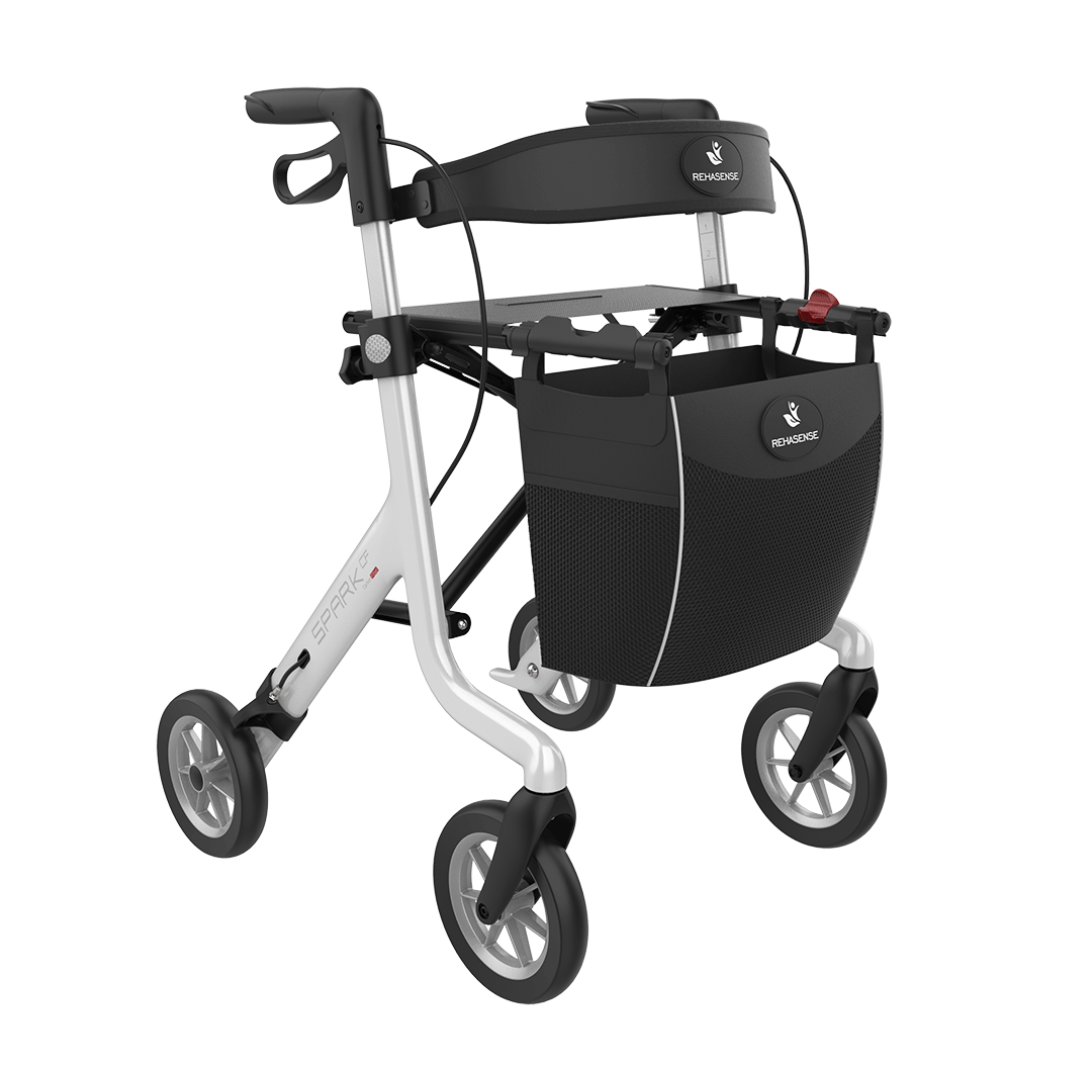 The Rehasense Spark CF Carbon Fiber Ultralight Rollator features four wheels, a black basket, hand brakes, and a sturdy white and black frame, making it an excellent lightweight mobility aid.