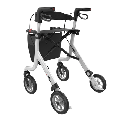 The Rehasense Spark CF Carbon Fiber Ultralight Rollator is a lightweight, foldable mobility aid with four large wheels, hand brakes, and a black pouch below the handles for convenient storage.