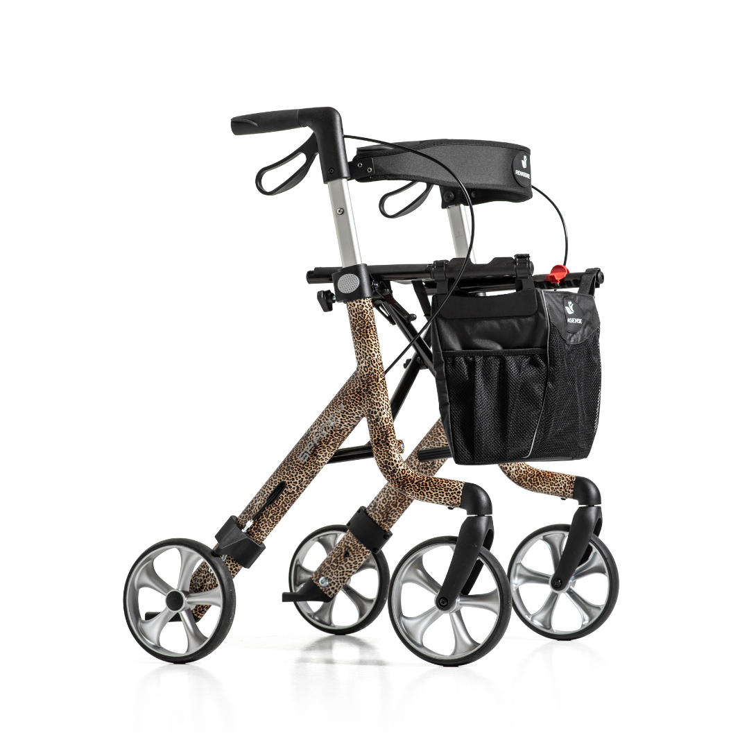 The Rehasense Space LX Art Deco Ultralight Rollator features four large gray wheels, a leopard print aluminium frame, black handles, and a black mesh storage bag.