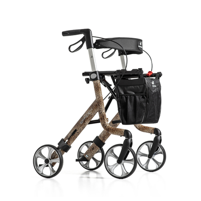The Rehasense Space LX Art Deco Ultralight Rollator features four large gray wheels, a leopard print aluminium frame, black handles, and a black mesh storage bag.