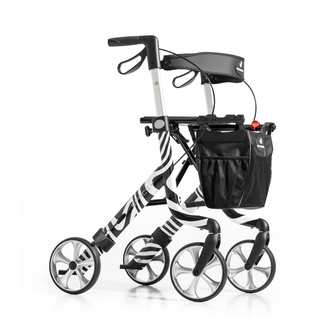 The Rehasense Space LX Art Deco Ultralight Rollator features four wheels, a zebra stripe design, black seat, hand brakes, and a front storage bag—offering stylish and functional mobility in a lightweight frame.