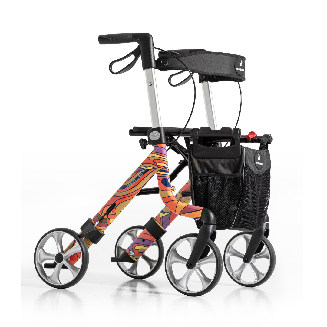 The Rehasense Space LX Art Deco Ultralight Rollator features large wheels, a black mesh storage bag, and a vibrant abstract frame design, displayed against a plain white background.