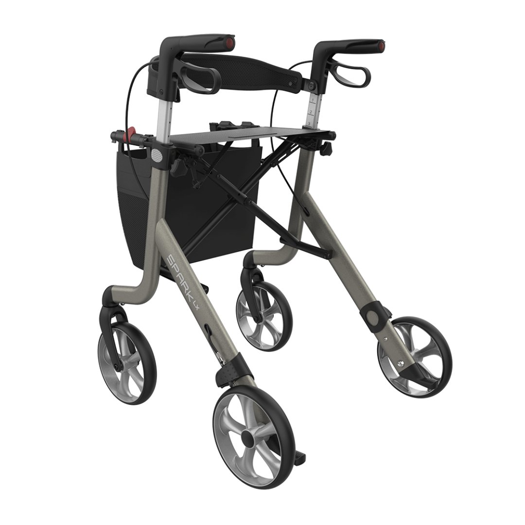 The Rehasense Spark LX Ultralight Rollator is a lightweight aluminum rollator with four large wheels, hand brakes, ergonomic handles, and a black storage bag. Its metallic gray frame and black accents make it perfect for daily mobility needs.