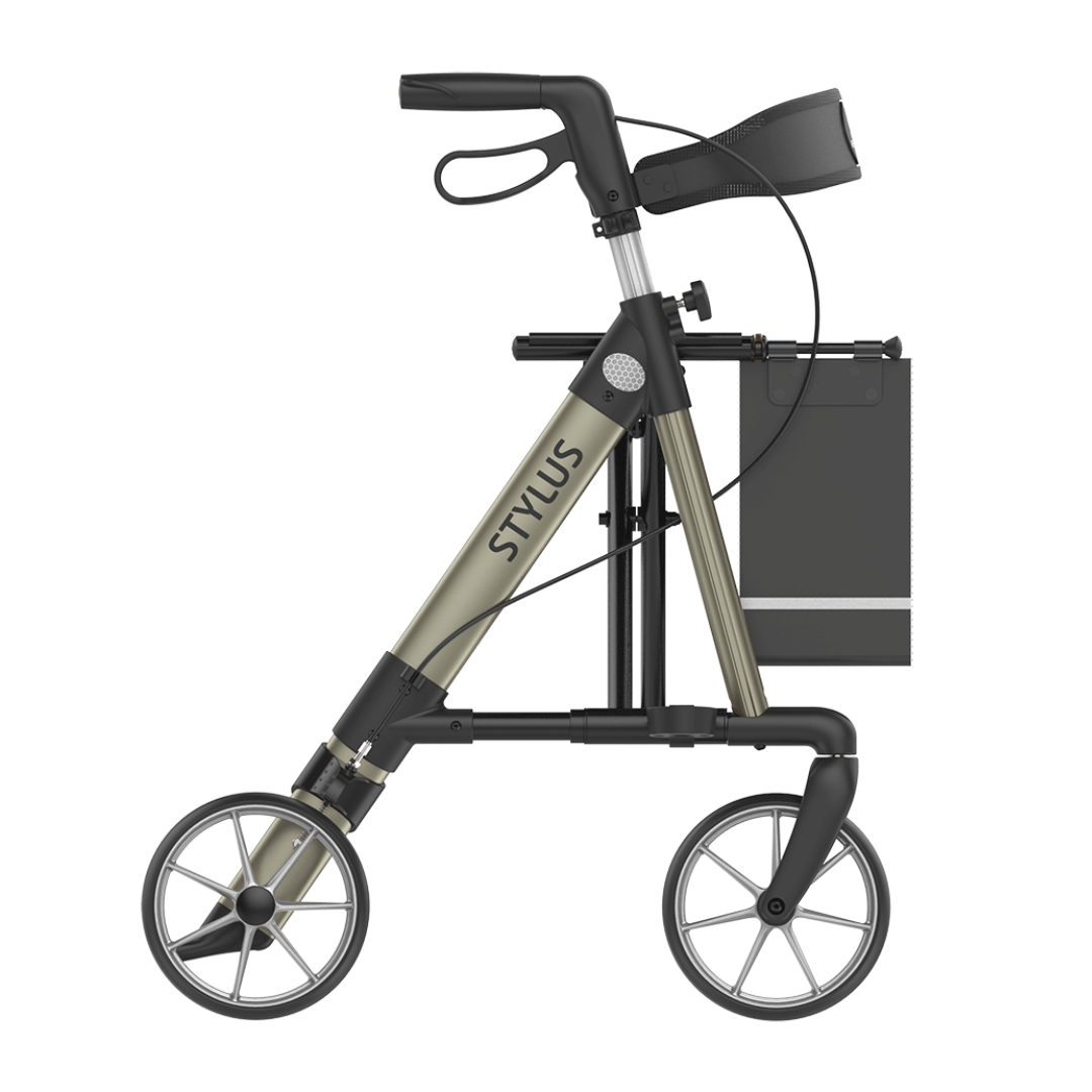 The Rehasense Stylus Premium Indoor & Outdoor Rollator features a lightweight design, large front and small rear wheels, black handlebar with hand brake, and a black storage bag attached to the frame—ideal for indoor and outdoor use.