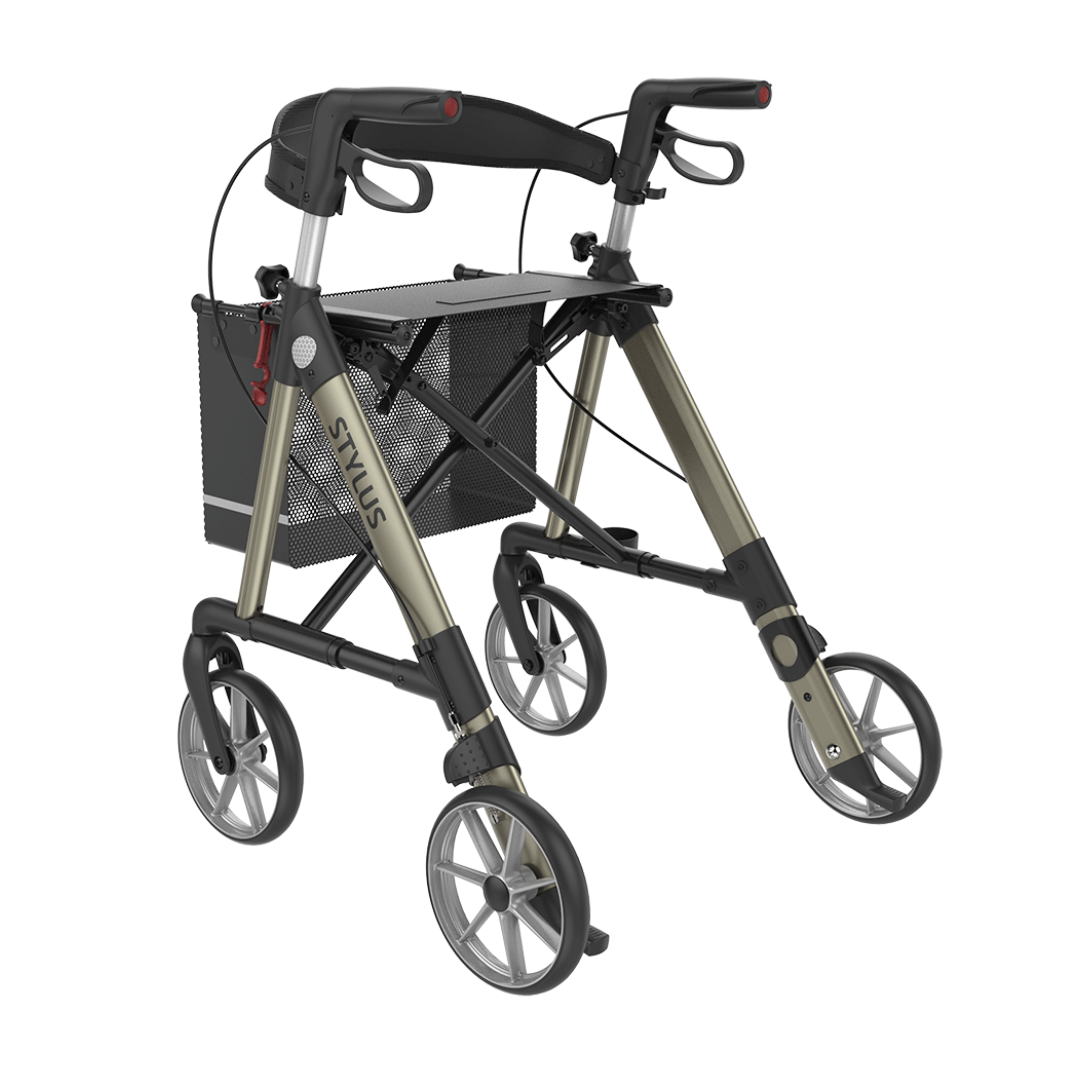 The Rehasense Stylus Premium Indoor & Outdoor Rollator is lightweight, foldable, has four wheels, ergonomic hand grips, a mesh storage basket, and "STYLUS" branding—ideal for both indoor and outdoor use.