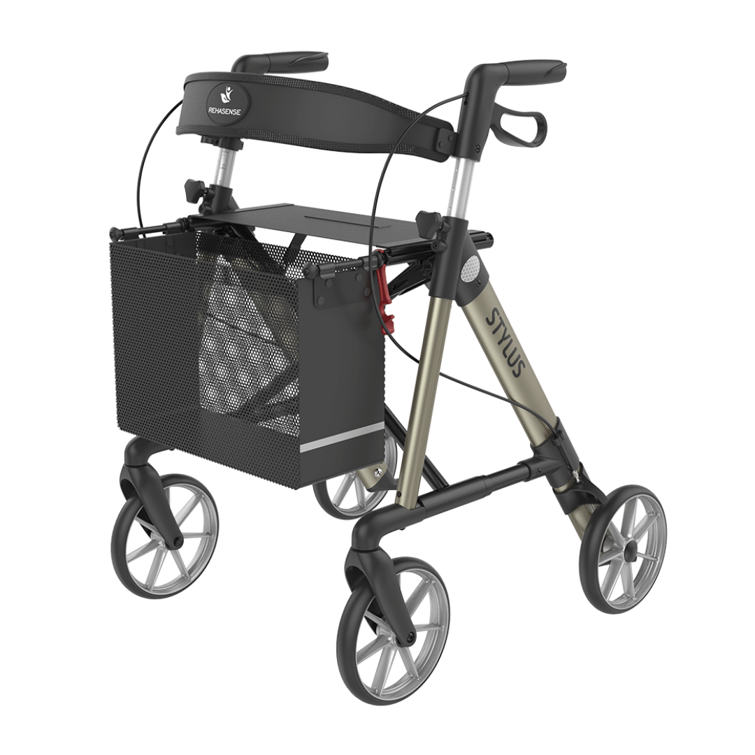 The Rehasense Stylus Premium Indoor & Outdoor Rollator features four wheels, a mesh storage basket, hand brakes, and a padded seat in beige and black—ideal for use both indoors and outdoors.