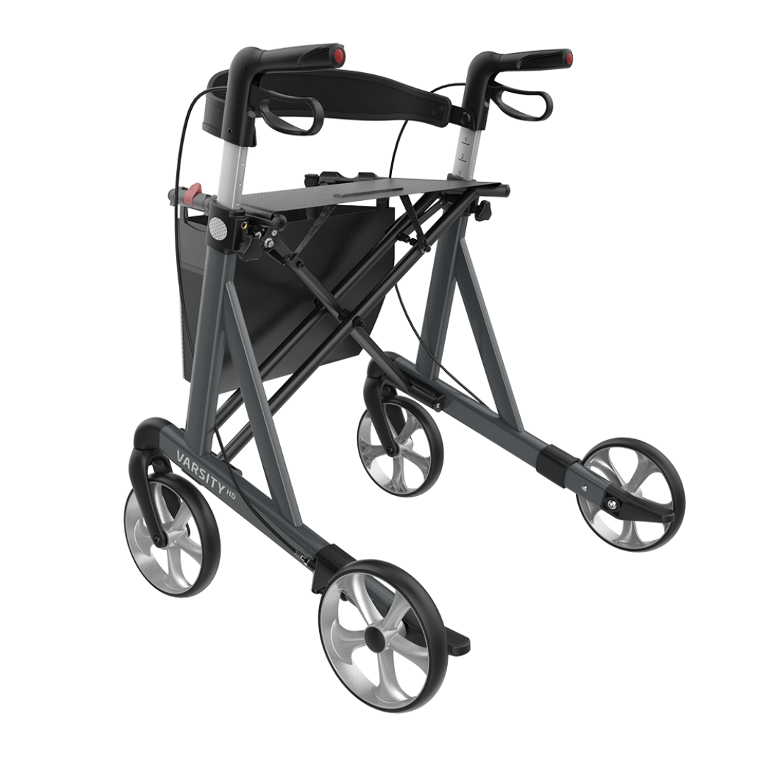 The Rehasense Varsity HD XL Bariatric Lightweight Rollator features a black and gray aluminum frame with hand brakes, seat, and under-seat storage, labeled VARSITY PRO on the frame.