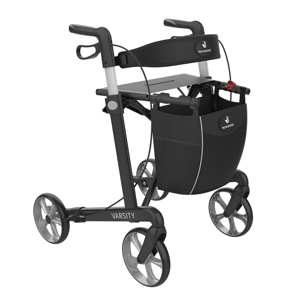 A black and silver Rehasense Varsity Folding Aluminum Rollator featuring a front storage bag, adjustable handles, built-in seat, and Varsity branding on the lightweight frame.