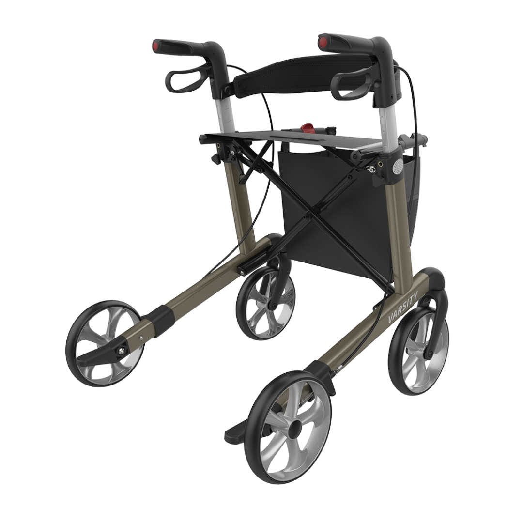 The Rehasense Varsity Folding Aluminum Rollator features four large wheels, ergonomic handles with hand brakes, a black seat with a storage pouch below, and a stylish metallic frame with black accents.