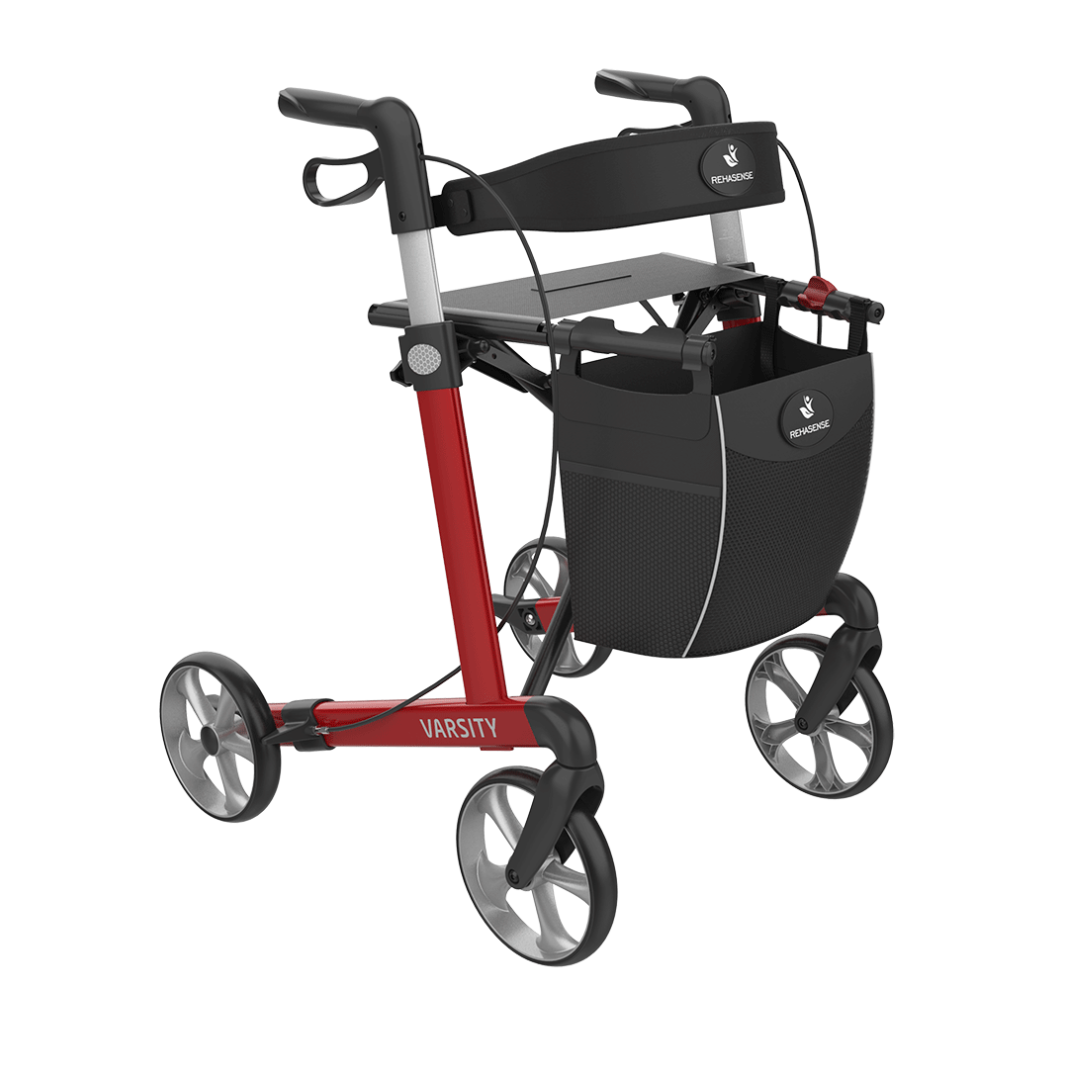 A lightweight Rehasense Varsity Folding Aluminum Rollator in red and black, featuring four wheels, hand brakes, a foldable seat, and a front storage bag for dependable mobility assistance.