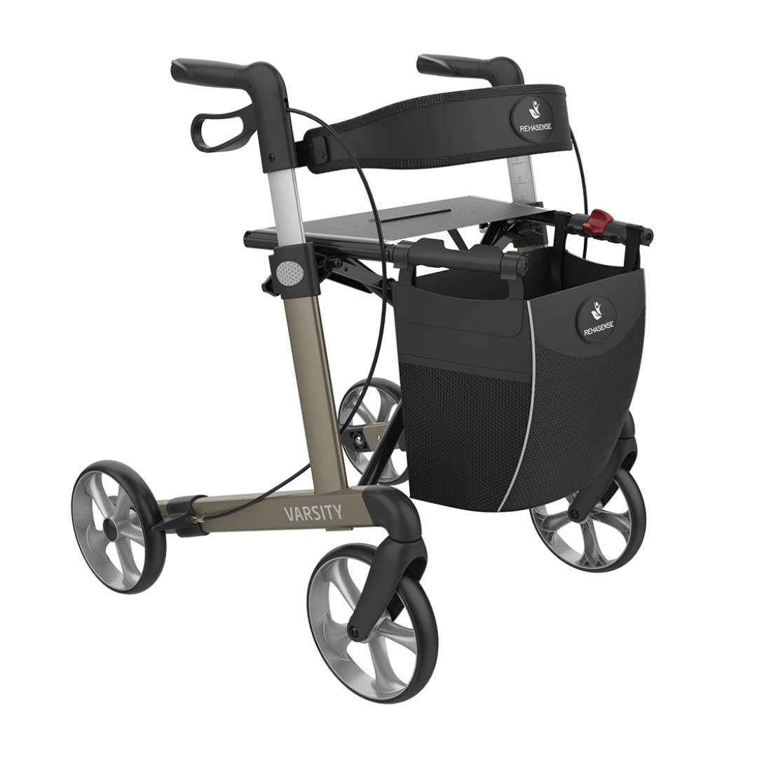 The Rehasense Varsity Folding Aluminum Rollator is modern and lightweight, featuring four wheels, a black and gray frame, ergonomic handles, built-in seat, and a detachable storage bag for convenience.