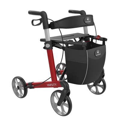 The Rehasense Varsity Folding Aluminum Rollator features four wheels, a padded seat, hand brakes, and a mesh storage bag in a red and black design, offering lightweight mobility support with added convenience.