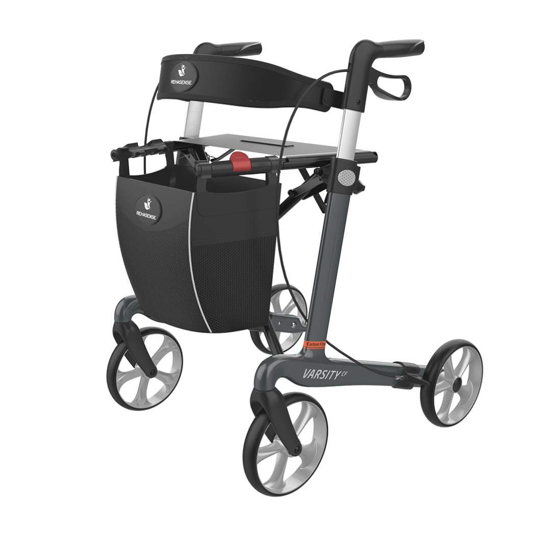The Rehasense Varsity CF Ultra-Lite Carbon Fiber Rollator is a lightweight black and gray mobility aid with four wheels, seat, handlebars, and a front storage bag for convenient assistance.