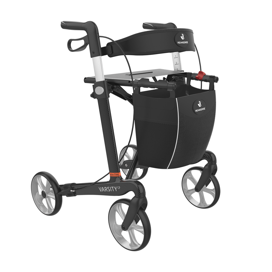 The Rehasense Varsity CF Ultra-Lite Carbon Fiber Rollator is a sleek black and silver rollator featuring ergonomic hand grips, a mesh storage bag, and a foldable frame for easy transport.