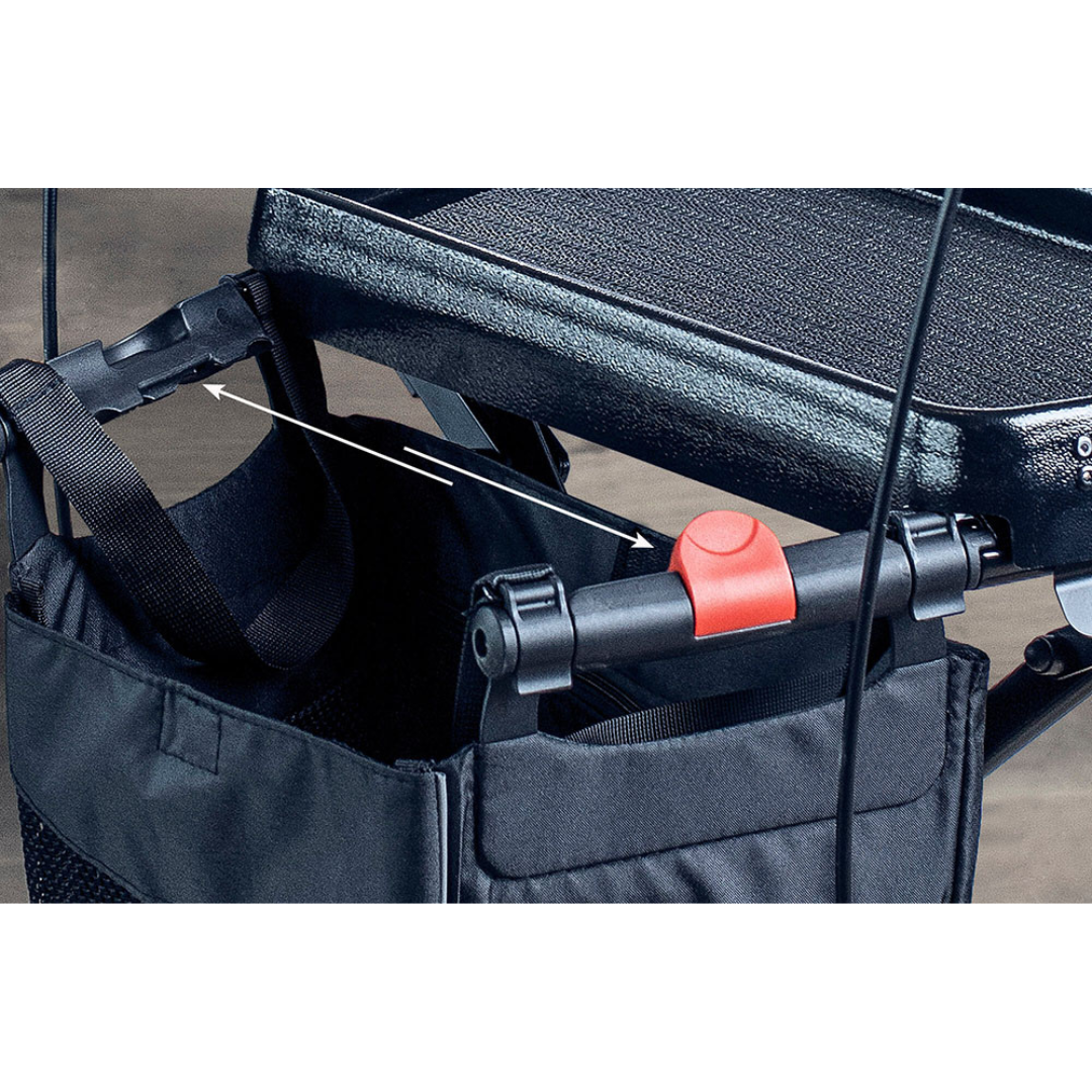 Close-up of the Rehasense Varsity HD XL- Bariatric Lightweight Rollator's black frame, black fabric storage basket, handlebar with red button, and secure straps attached to the extra-strong rollator frame.