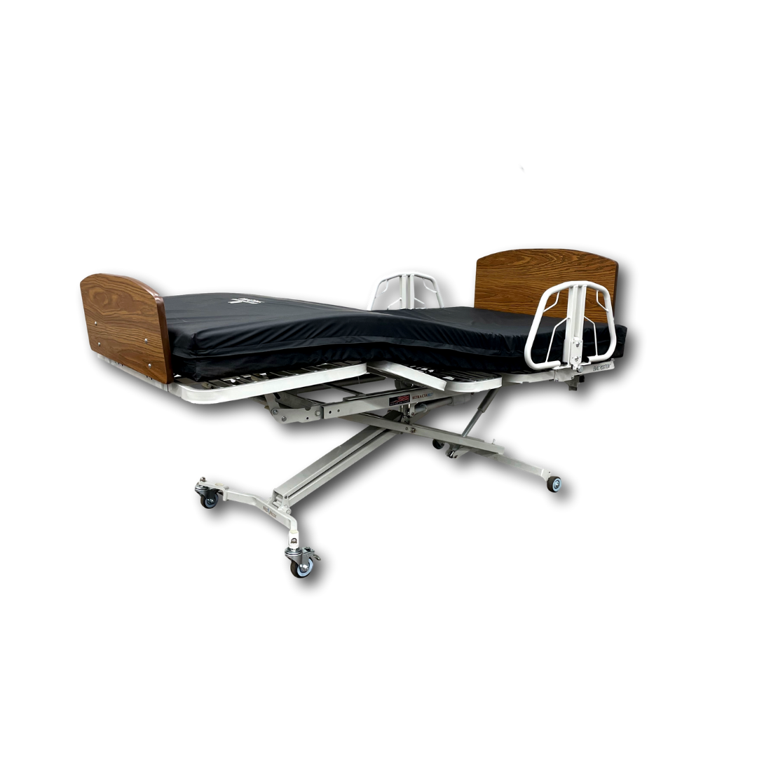 The Med-Mizer RetractaBed Bariatric Hi/Low Electric Bed features adjustable width, a black mattress, wooden headboard and footboard, white metal frame, safety rails, and wheels—perfect for modern hospital spaces.