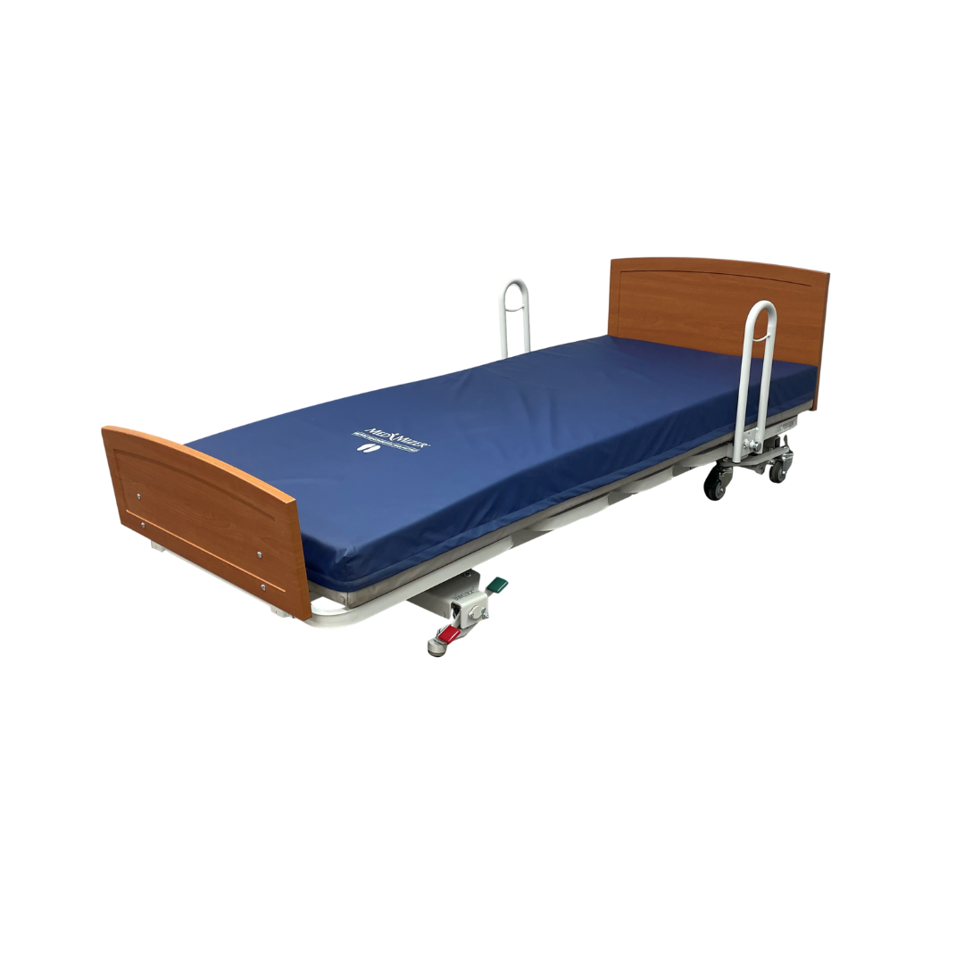The Med-Mizer RetractaBed Bariatric Hi/Low Electric Bed, width adjustable, features a blue mattress, wooden headboard and footboard, white metal frame, wheeled mobility, and a space-saving safety design, shown against a white background.