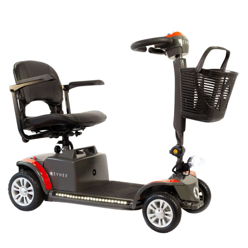 The Reyhee Cruiser, an FDA-cleared red and black electric mobility scooter, features a comfortable seat, armrests, a handy front basket, and four wheels for stability. Its LED base lights enhance visibility, while the foldable tiller offers convenience for transport and storage.