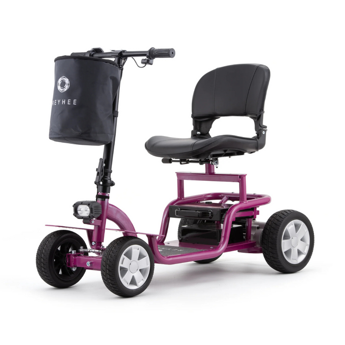 The Reyhee EXO Portable 4-Wheel Mobility Scooter boasts a stylish purple design with a comfortable black seat, handlebars, footrest, front basket, and visible rear battery compartment, merging mobility and elegance.