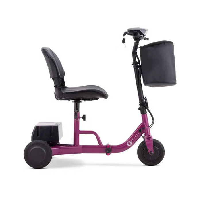 The Reyhee Triad Compact Folding Electric Mobility Scooter, in purple, is a portable three-wheeled scooter designed for easy transport, featuring a comfortable seat, large front basket, and an innovative rear Swap & Go Battery System for enhanced accessibility.