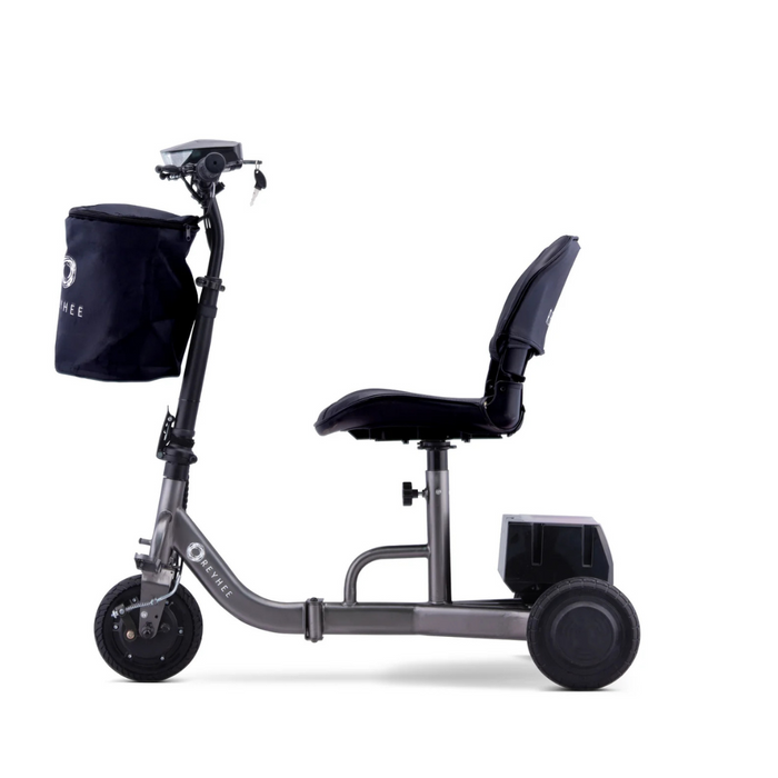 Side view of the Reyhee Triad Compact Folding Electric Mobility Scooter, featuring a sleek silver design with a black seat, handlebar, and front storage bag. This portable scooter offers easy transport with front and rear wheels plus an innovative Swap & Go Battery System for seamless power management.