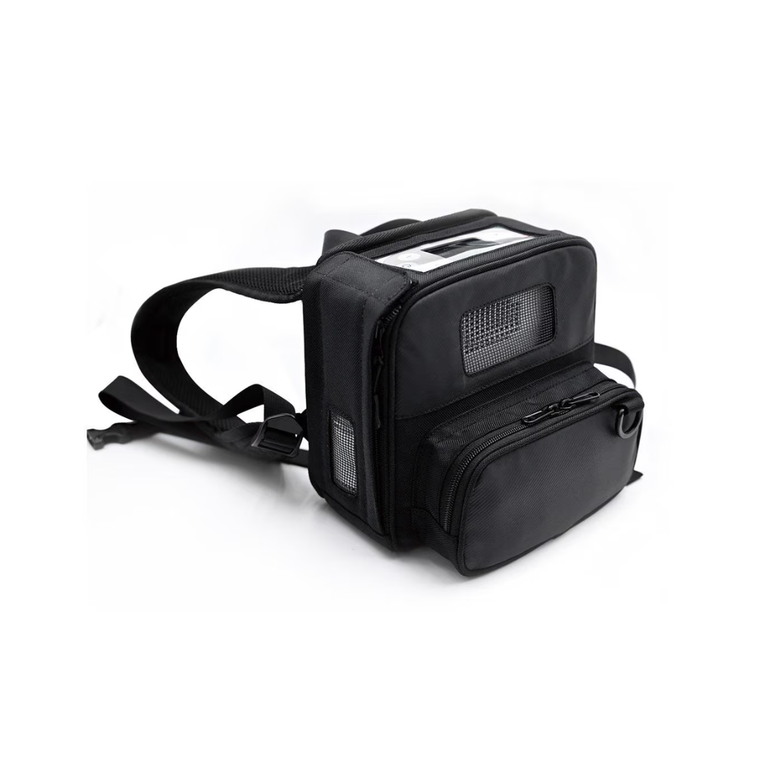 The Rhythm O2 Portable Concentrator Backpack is a black, soft-sided carrier with mesh panels, zippered pockets, and adjustable straps—perfect for carrying your oxygen concentrator or as a pet carrier.
